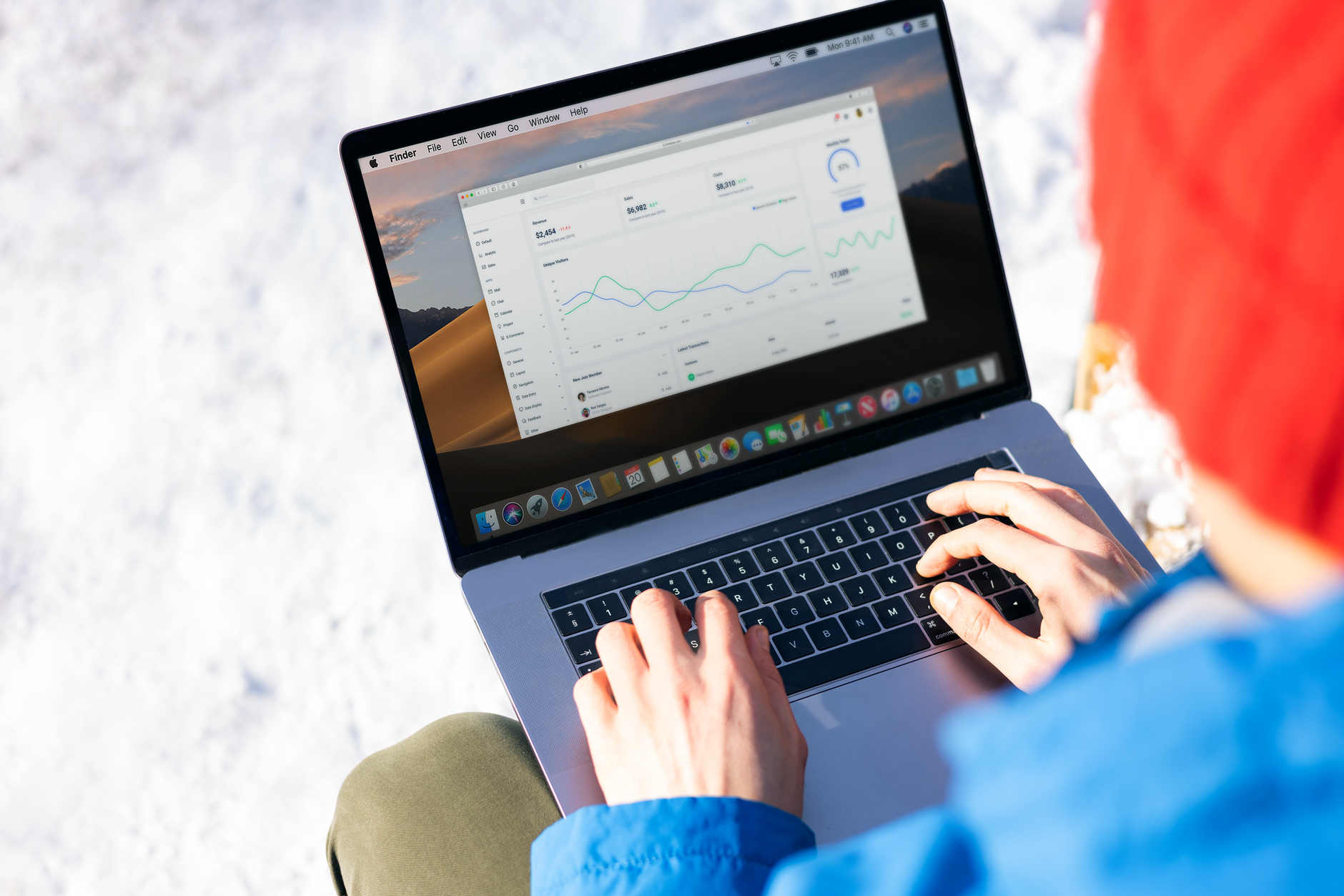 a person viewing an automation analytics dashboard on a monitor
