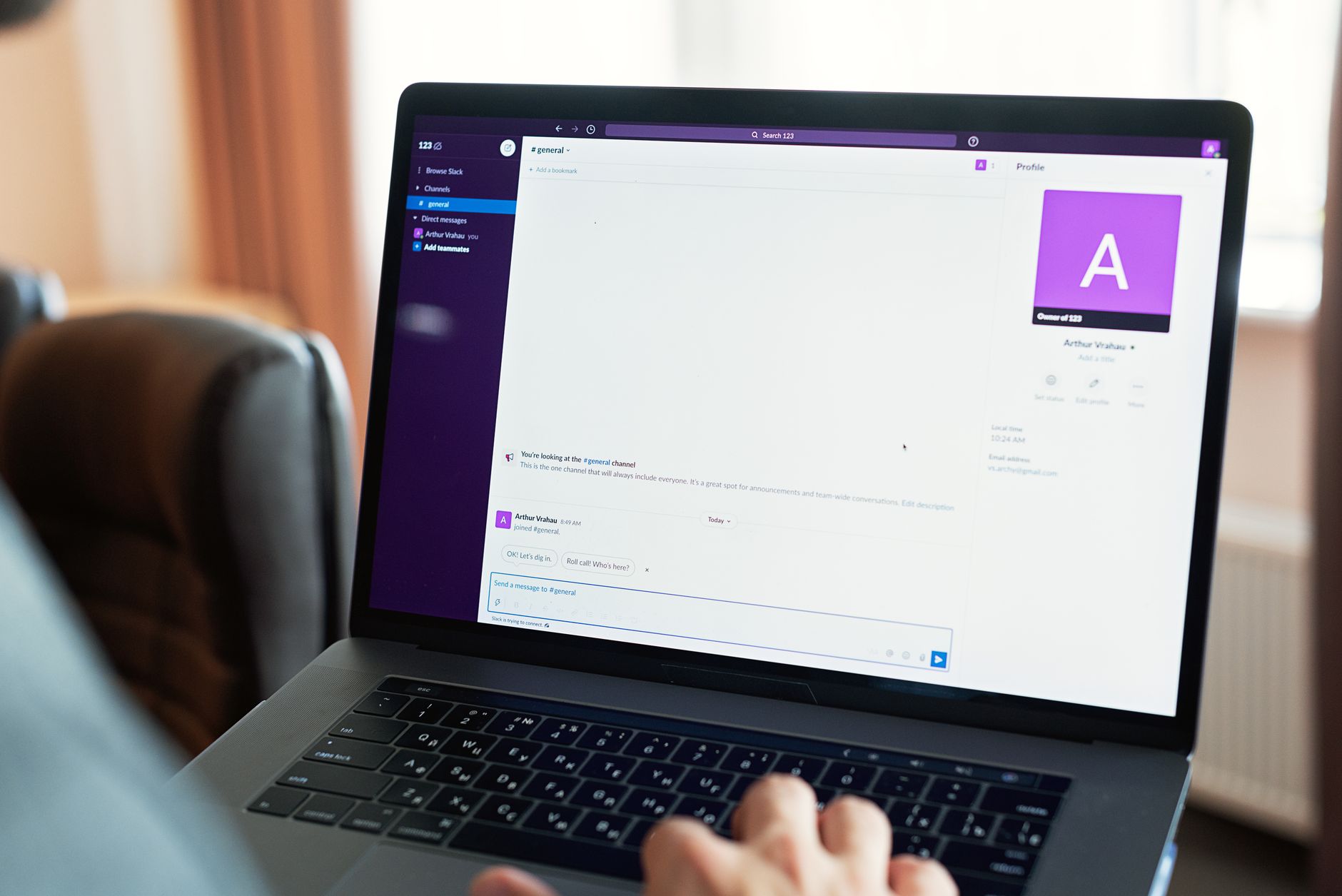 an n8n workflow with a Slack action node on a computer monitor