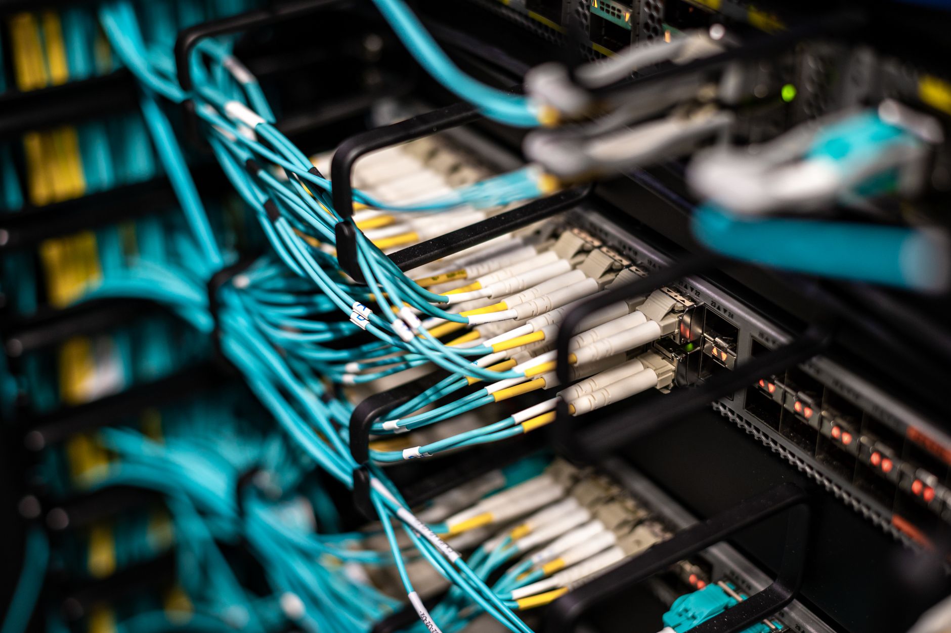 data center server rack with glowing network cables